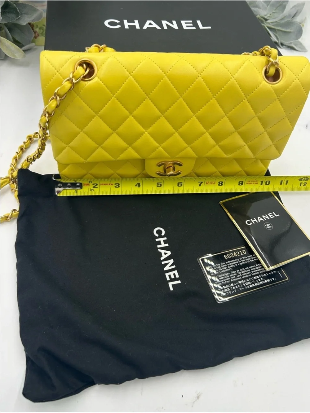 CHANEL CLASSIC QUILTED double flap bag . Yellow with gold hardware .
